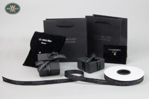 Cicada Gallery Crete: Paper, fabric and suede packaging with silver logo.