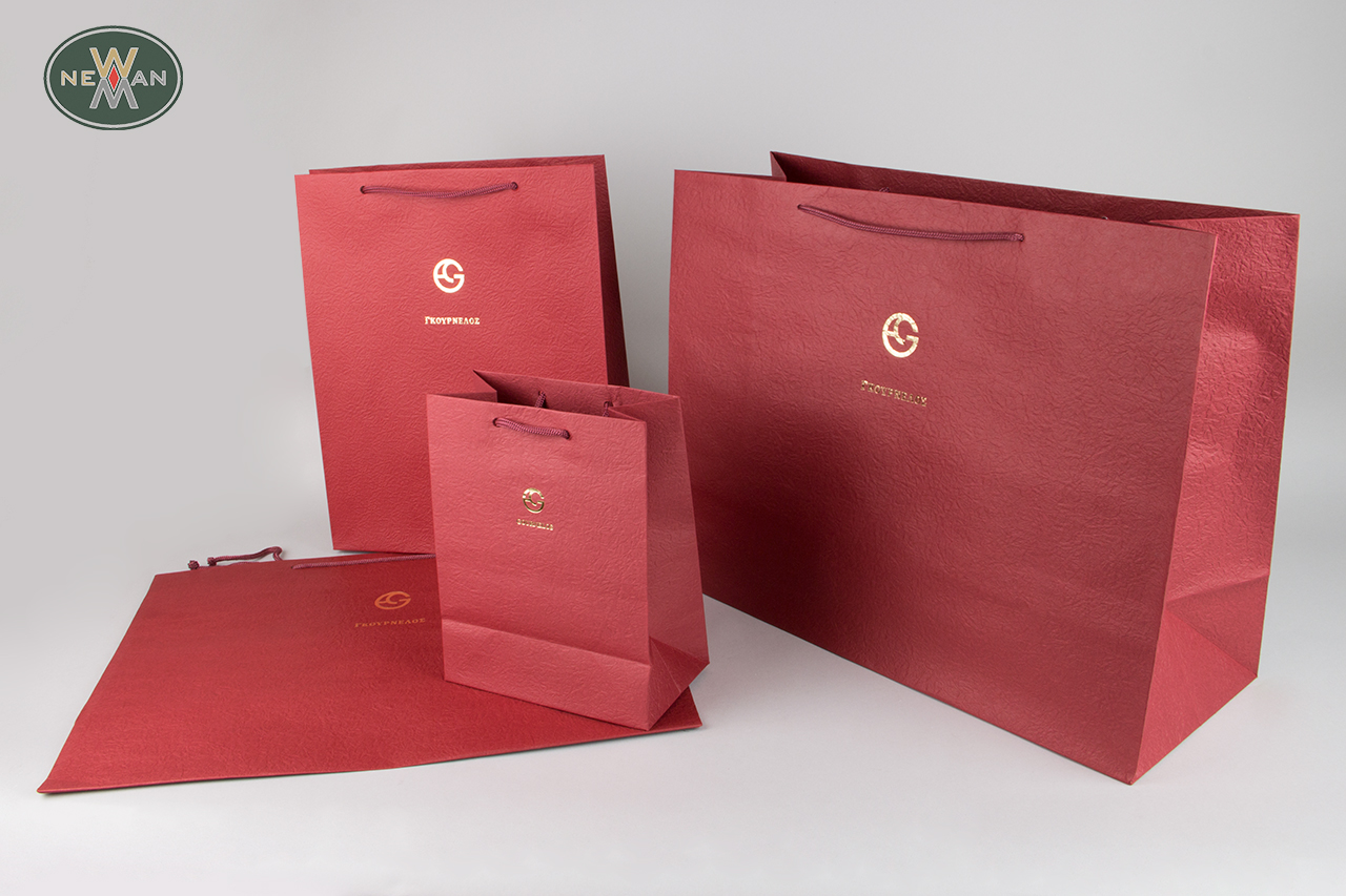 Red wholesale packaging bag with brand name printing.