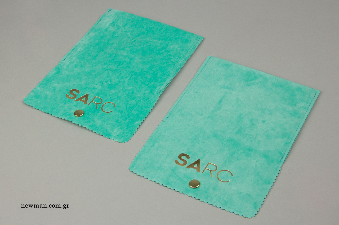 Suede wholesale packaging pouch with corporate print.
