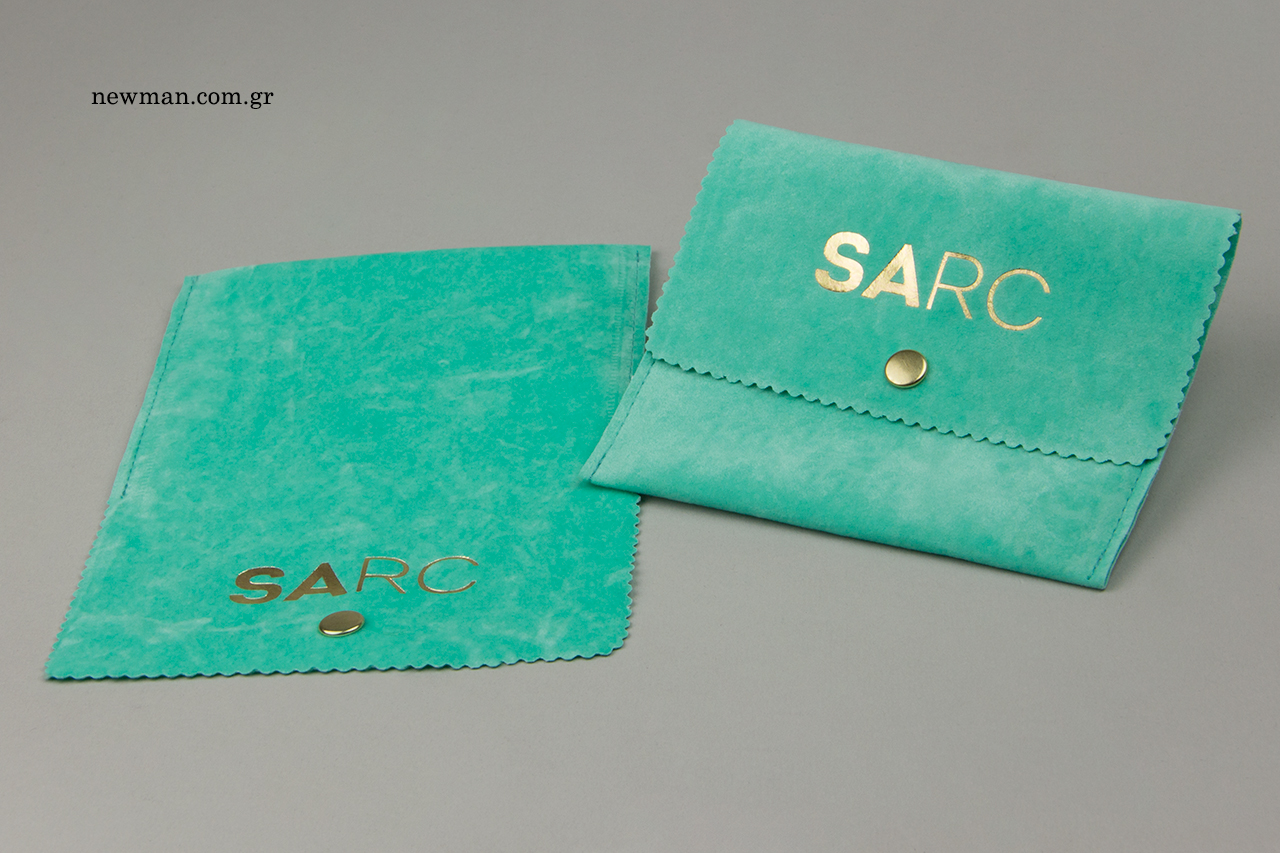 Bright green suede pouches with gold hot-foil logo printing.
