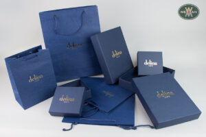 delina Crete: Blue luxury packaging with corporate name.