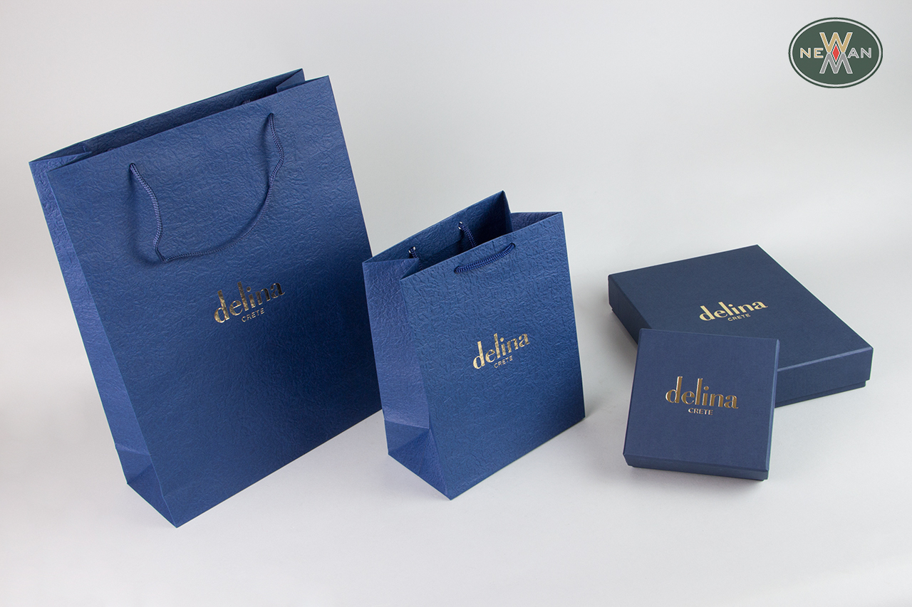 Blue packaging bags and boxes with gold hot-foil printing.