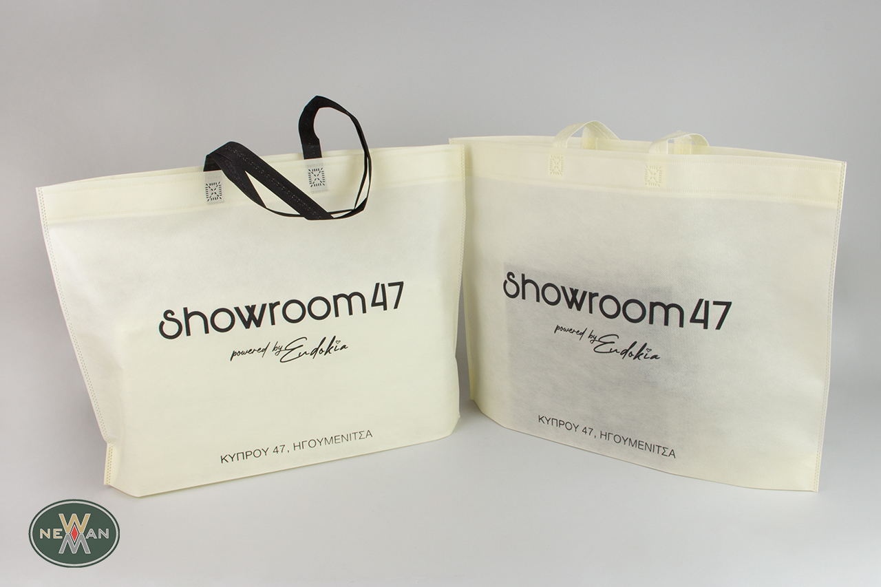 Non-woven, biodegradable bags with corporate name printing.