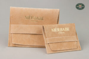 MÉRBABE: Gold hot-foil printing on NewMan branded packaging.