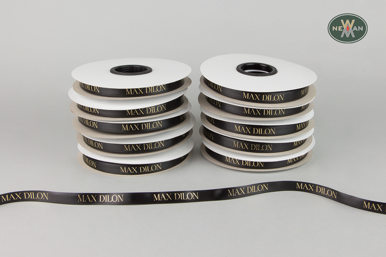 Corporate packaging ribbons with brand name.