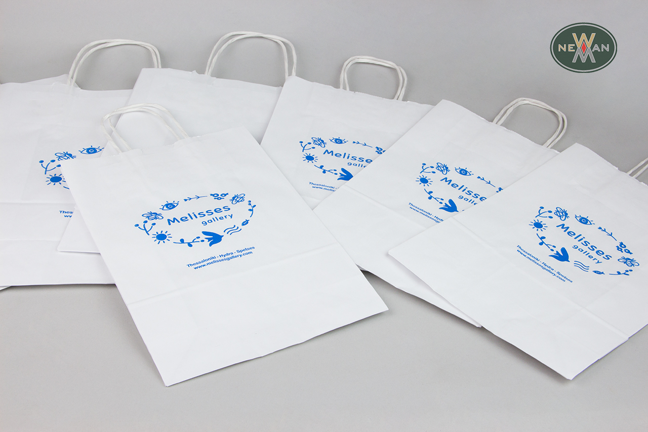 Eco-friendly paper carrier bags with blue printing.