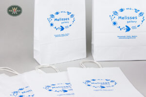 Melisses Gallery: Blue brand name print on eco paper shopping bags.