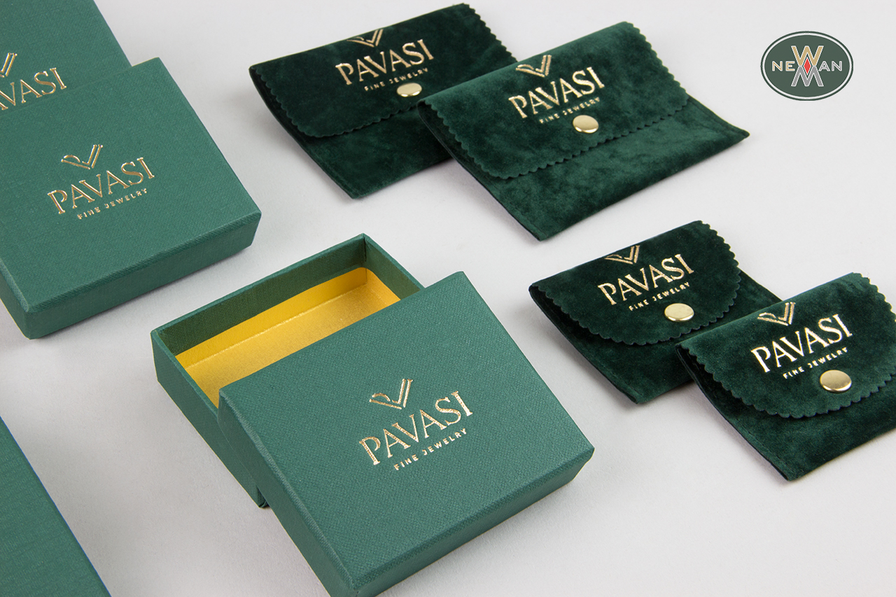 Gold logo on green NewMan packaging items.