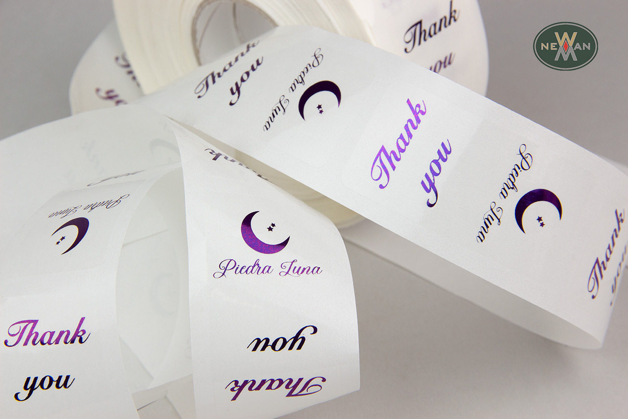 Wholesale sticky labels with clear background and purple printing.